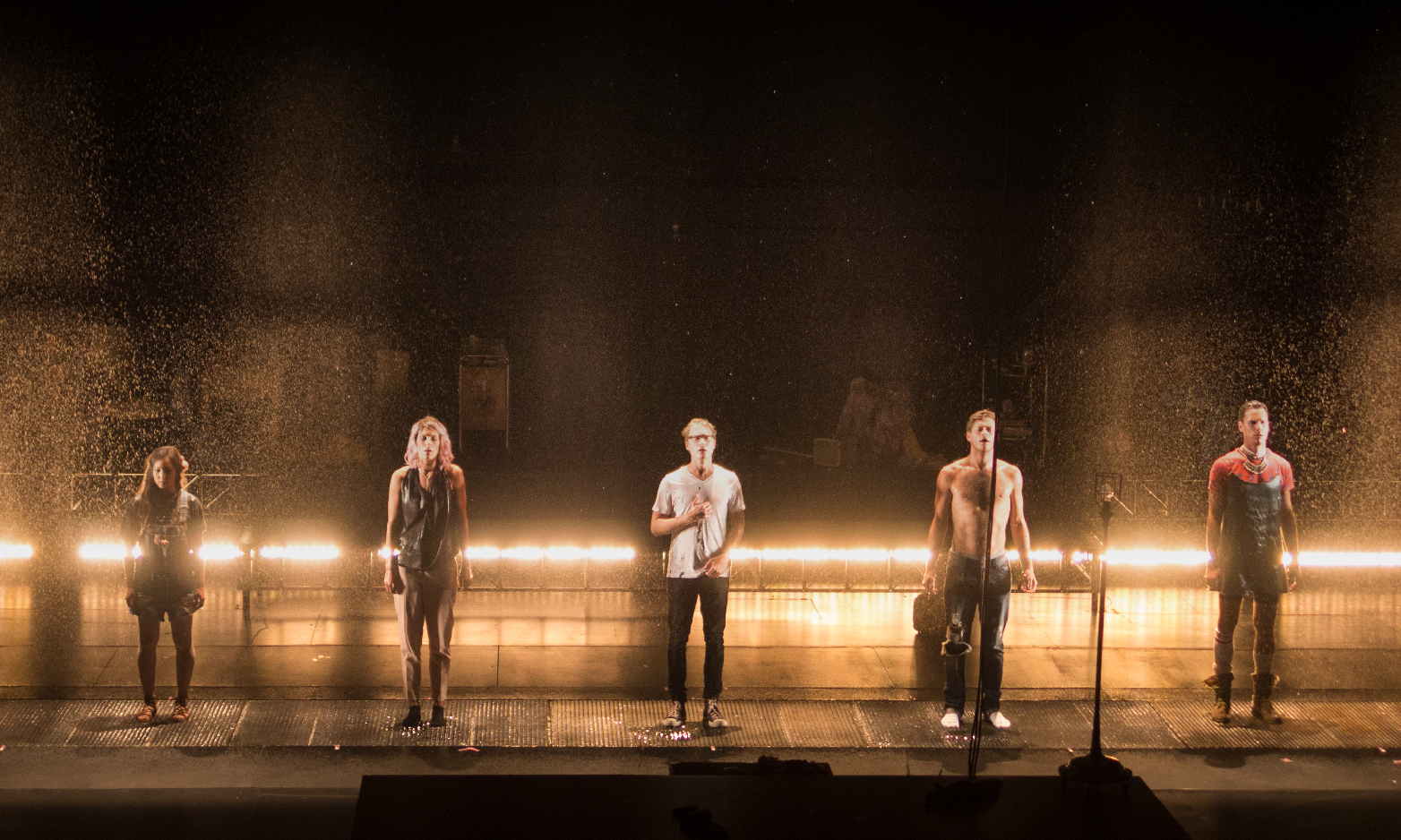 a picture of several people standing in harsh golden light